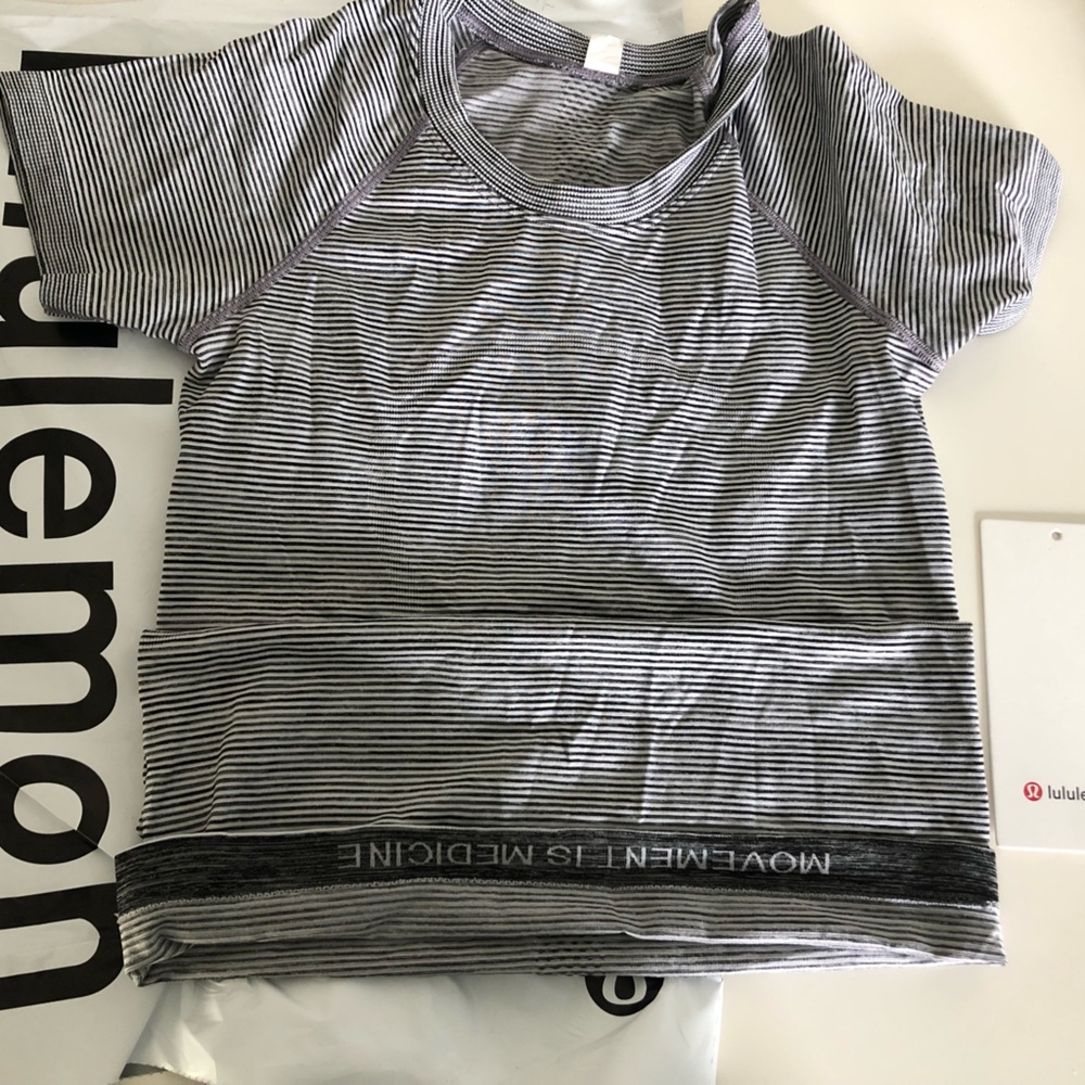 lululemon swiftly tech. size 2. in a grey and white stripes color.